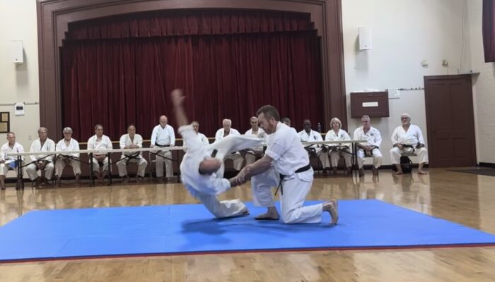 John executing a throw on Jeff
